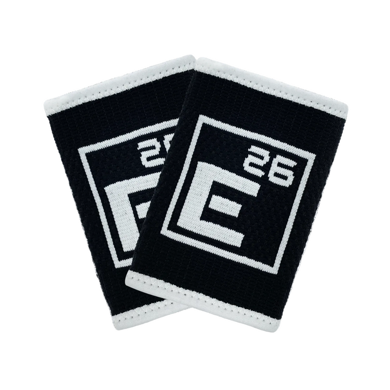 Load image into Gallery viewer, Two black wristbands with white text on a textured white background