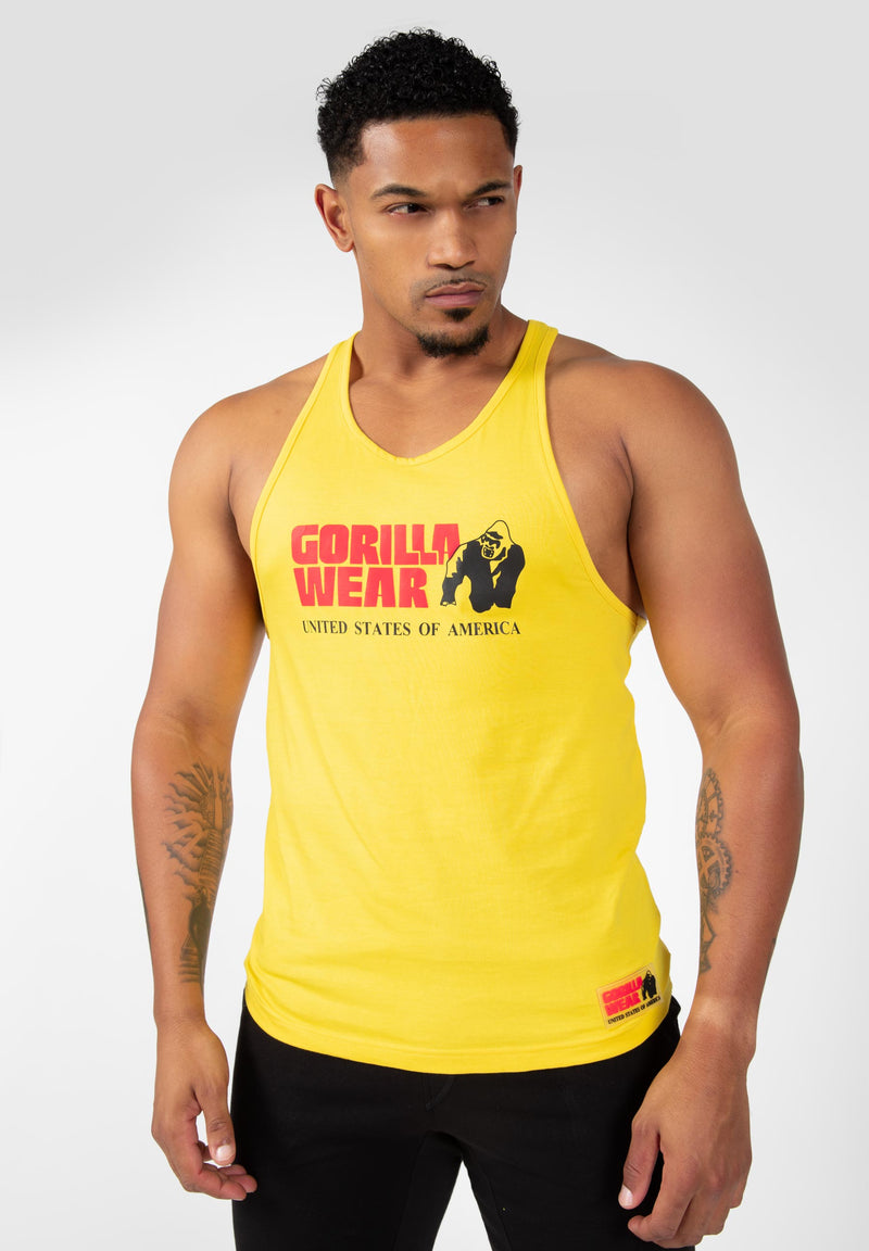 Load image into Gallery viewer, A male model wearing a yellow tank top with 'GORILLA WEAR' printed on the front.