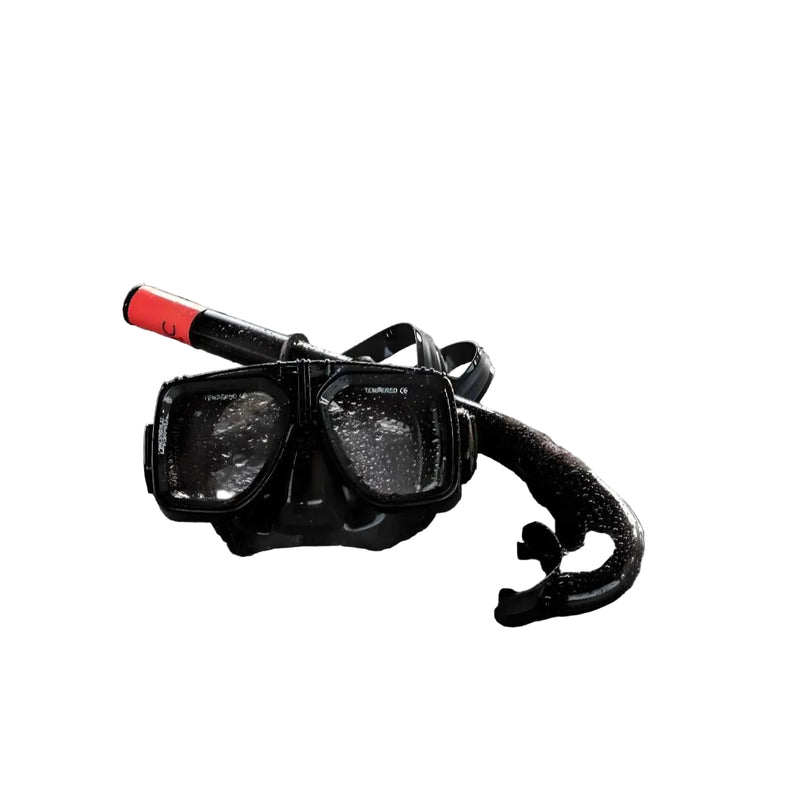 Load image into Gallery viewer, Diving mask and snorkel on a sandy beach with ocean waves in the background