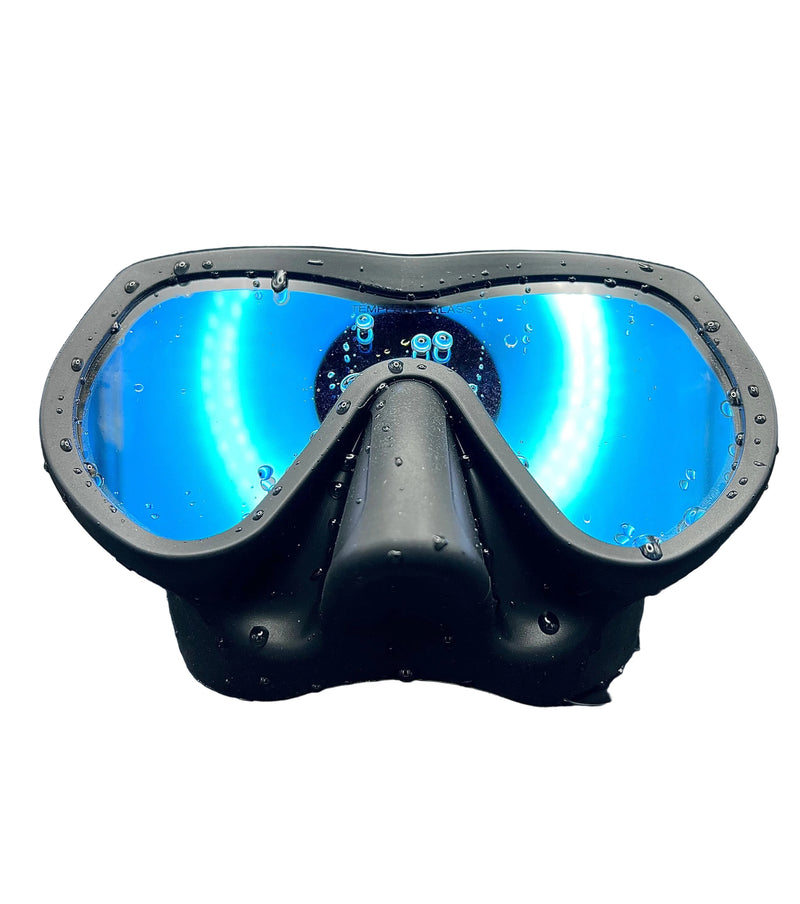 Load image into Gallery viewer, Black diving mask with blue lenses on a dark background
