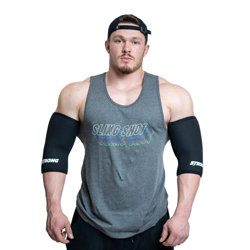 Load image into Gallery viewer, A person wearing gray elbow sleeves with the brand name 'STrong' on them.