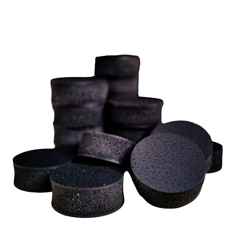 Load image into Gallery viewer, Multiple black barbell pillows arranged on a surface, designed to absorb shock and cushion barbells.