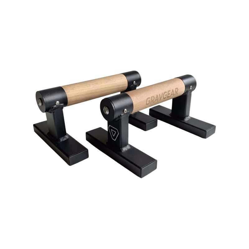 Load image into Gallery viewer, A pair of Grav Parallettes Edge with birch wooden handles and black metal bases.