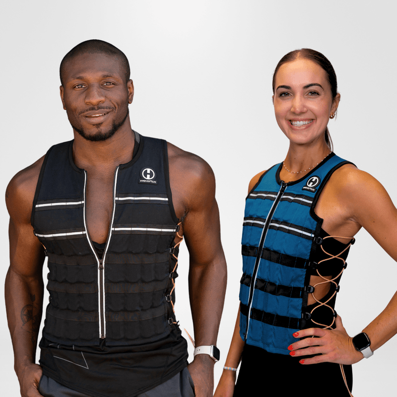 Load image into Gallery viewer, Two people wearing weighted vests on a plain background