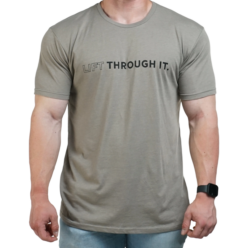 Load image into Gallery viewer, A person wearing a black crew neck t-shirt with the text 'Lift Through It' printed on the front.