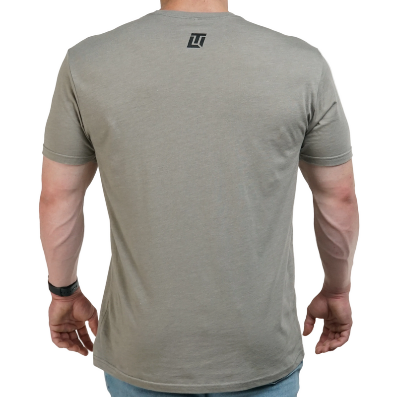 Load image into Gallery viewer, Person wearing a gray t-shirt with a logo on the back against a white background