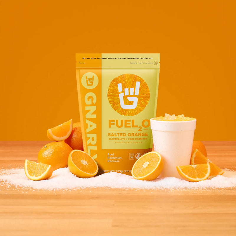 Load image into Gallery viewer, Gnarly Fuel2O Salted Orange - Lifestyle with Oranges
