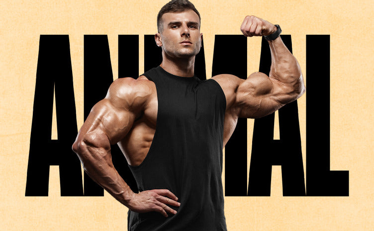 Load image into Gallery viewer, male bodybuilder flexing in front of a black and tan ANIMAL logo