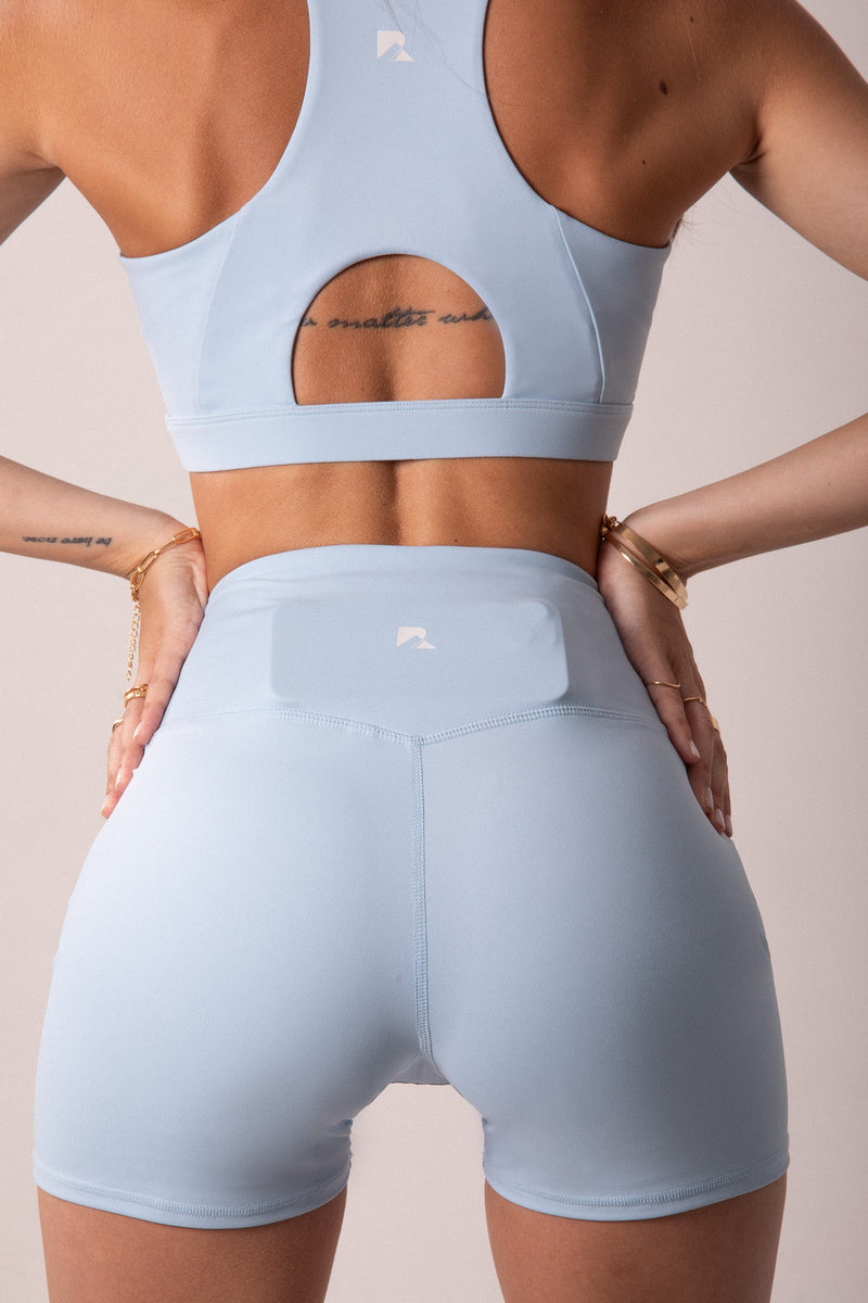 Load image into Gallery viewer, Runner's Athletics - Women's Sculpting Workout Shorts 5 Inch - Baby Blue | Criss-Cross Waistband with Pocket
