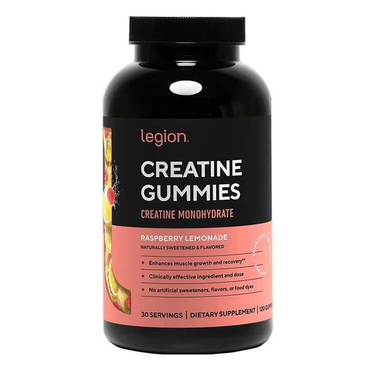 A black bottle of Legion Creatine Gummies with a black cap, featuring a label with a black top half and a coral-pink bottom half, on a white background.