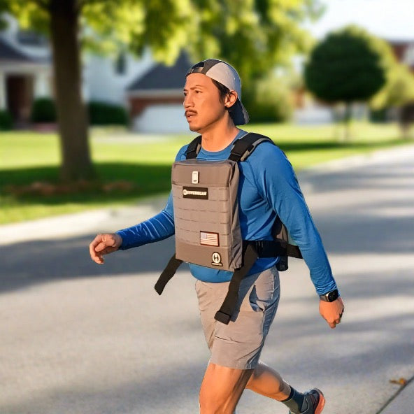 Load image into Gallery viewer, image of a man rucking with a 40lb hyper vest weight vest
