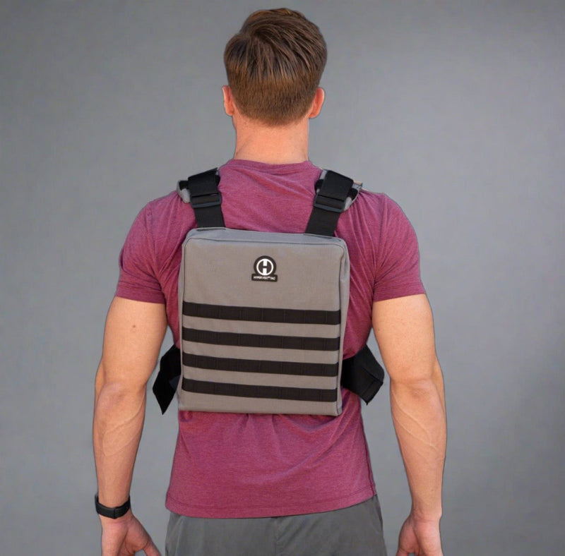 Load image into Gallery viewer, back view of male athlete wearing a Hyper Vest Tactical Weighted Vest
