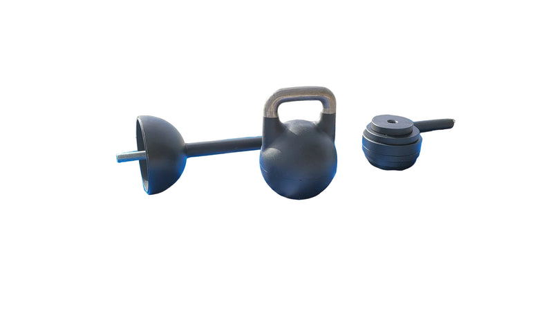Load image into Gallery viewer, Kettlebell and dumbbells on a blue mat with 'Kettlebell' branding on a beach.
