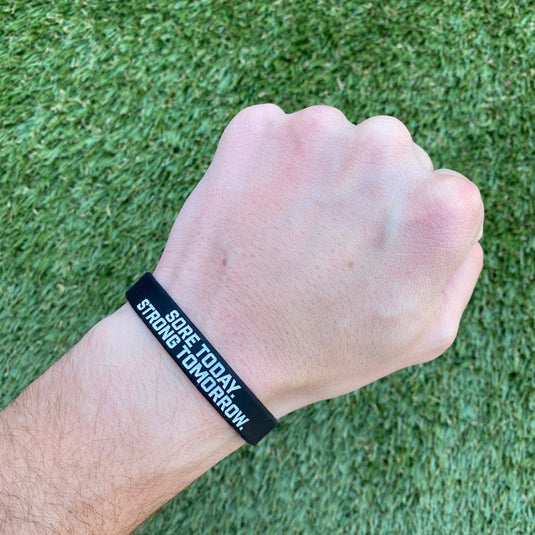 Elite Athletic Gear - Sore today. Strong tomorrow. Wristband.