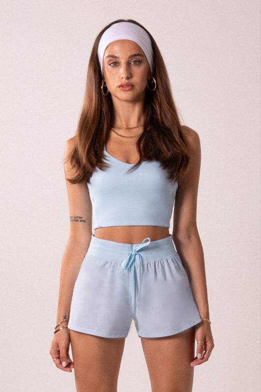 Runner's Athletics - Women's Workout Tank Top with Phone Pockets - Baby Blue | LuxeForm Criss-Cross Back